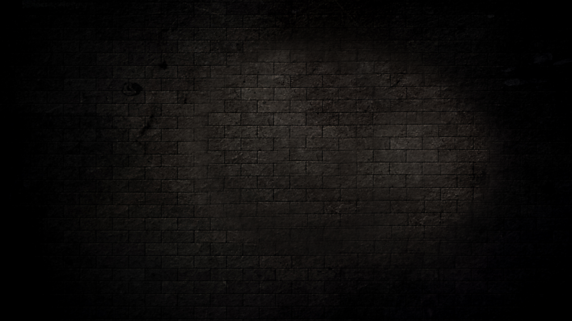 Black brick wall with darkened edges